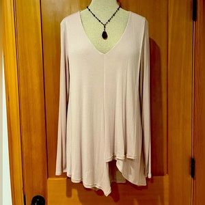 Super soft tunic length top with drapey asymmetrical detail